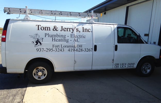 A Tom & Jerry's service van with the company lettering, both phone numbers and the Ohio license numbers on the side